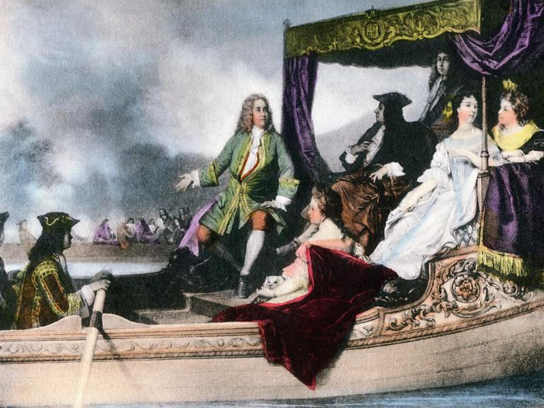 Eine historische Illustration zeigt ein barkenartiges Schiff mit dem britischen Hofstaat um 1715. Im Zentrum des Bildes: Der Komponist Georg Friedrich Händel und der britische König George I..