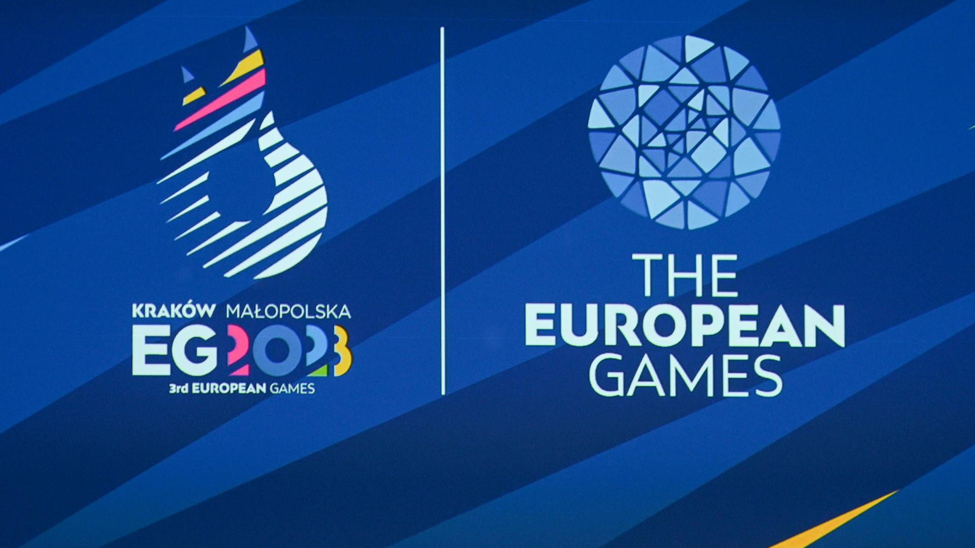 Das Logo der Europaspiele 2023 im polnischen Krakau vor blauem Hintergrund. Das Logo der Europaspiele 2023 im polnischen Krakau vor blauem Hintergrund.