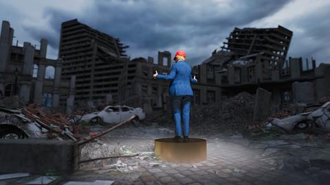 Mann in blauem Anzug und roter Mütze, der auf einem Sockel steht und mit erhobenem Daumen auf eine dystopische Szenerie blickt