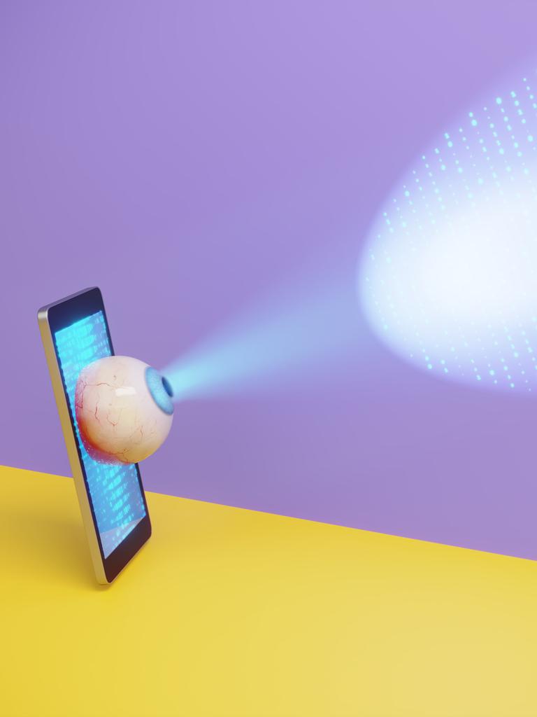 Ein Smartphone mit einem hervorstehenden Auge projiziert einen digitalen Scanstrahl auf schwebende Binärdaten und symbolisiert damit mobile Überwachung, Datenverfolgung und Datenschutzbedenken.