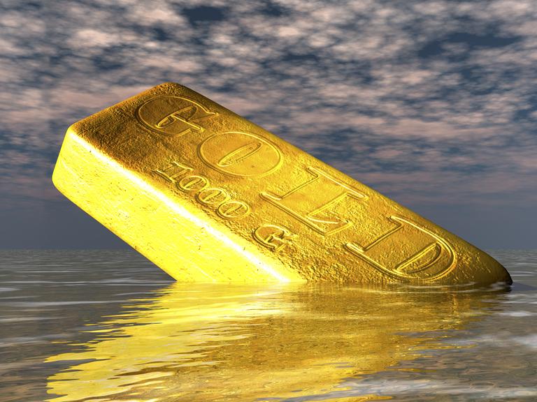 Zu sehen ist ein goldfarbener Barren mit der Aufschrift "Gold"