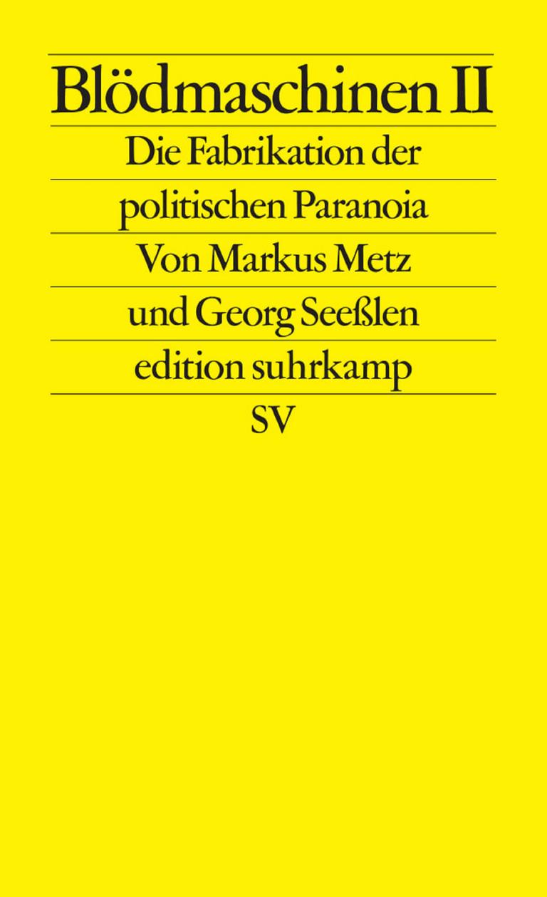 Gelbes Buchcover mit schwarzer Typo: "Blödmaschinen II. Die Fabrikation der politischen Paranoia" von Markus Metz und Georg Seeßlen. Gelbes Buchcover mit schwarzer Typo: "Blödmaschinen II. Die Fabrikation der politischen Paranoia" von Markus Metz und Georg Seeßlen.