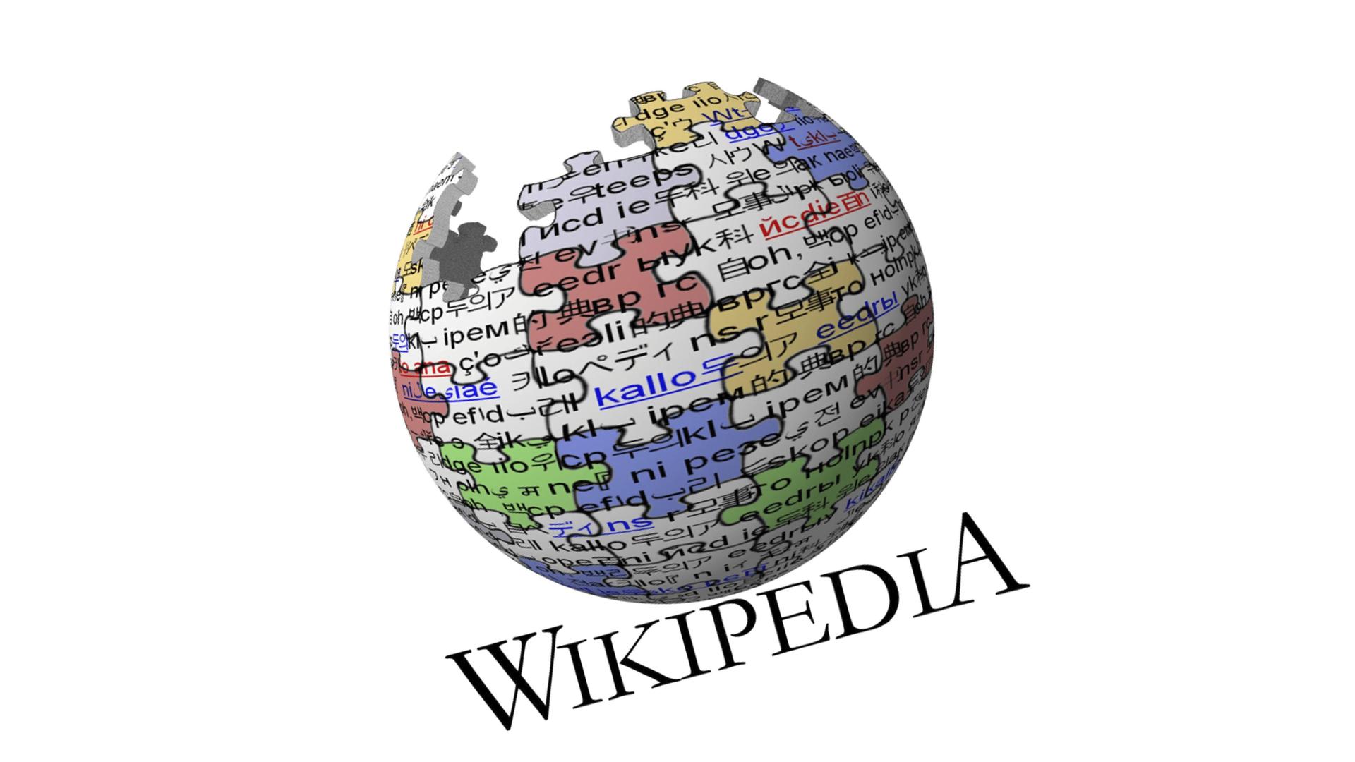 Ein Logo von Wikipedia zeigt den Erdball als Kugel aus farbigen Pauzzleteilen.