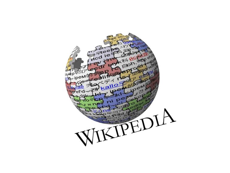 Ein Logo von Wikipedia zeigt den Erdball als Kugel aus farbigen Pauzzleteilen.