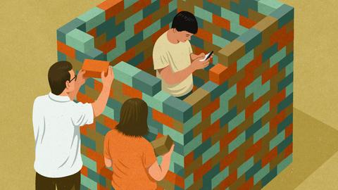 Eltern bauen Backsteinmauer um den Sohn herum, der auf ein Smartphone schaut