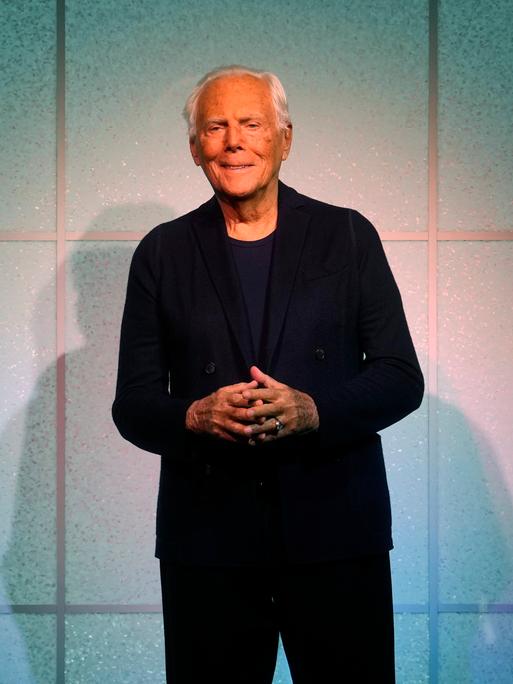Designer Giorgio Armani accepts applause after the conclusion of his women's Fall-Winter 2024-25 collection presented in Milan, Italy, Sunday, Feb. 25, 2024. (AP Photo/Luca Bruno)