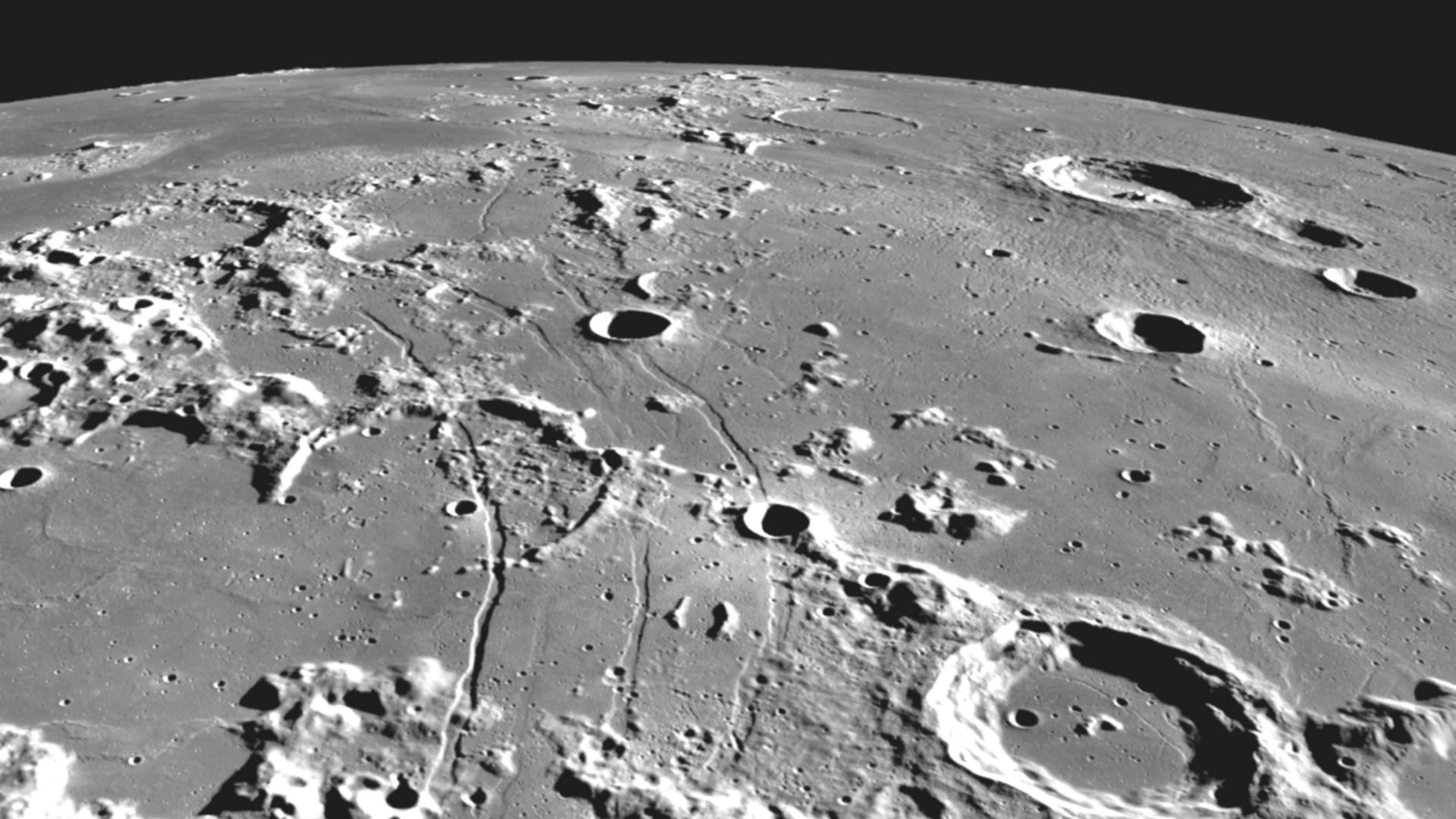 Abgebildet ist die Oberfläches des Mondes, also zerklüftete Landschaft mit vielen Kratern. Abgebildet ist die Oberfläches des Mondes, also zerklüftete Landschaft mit vielen Kratern.