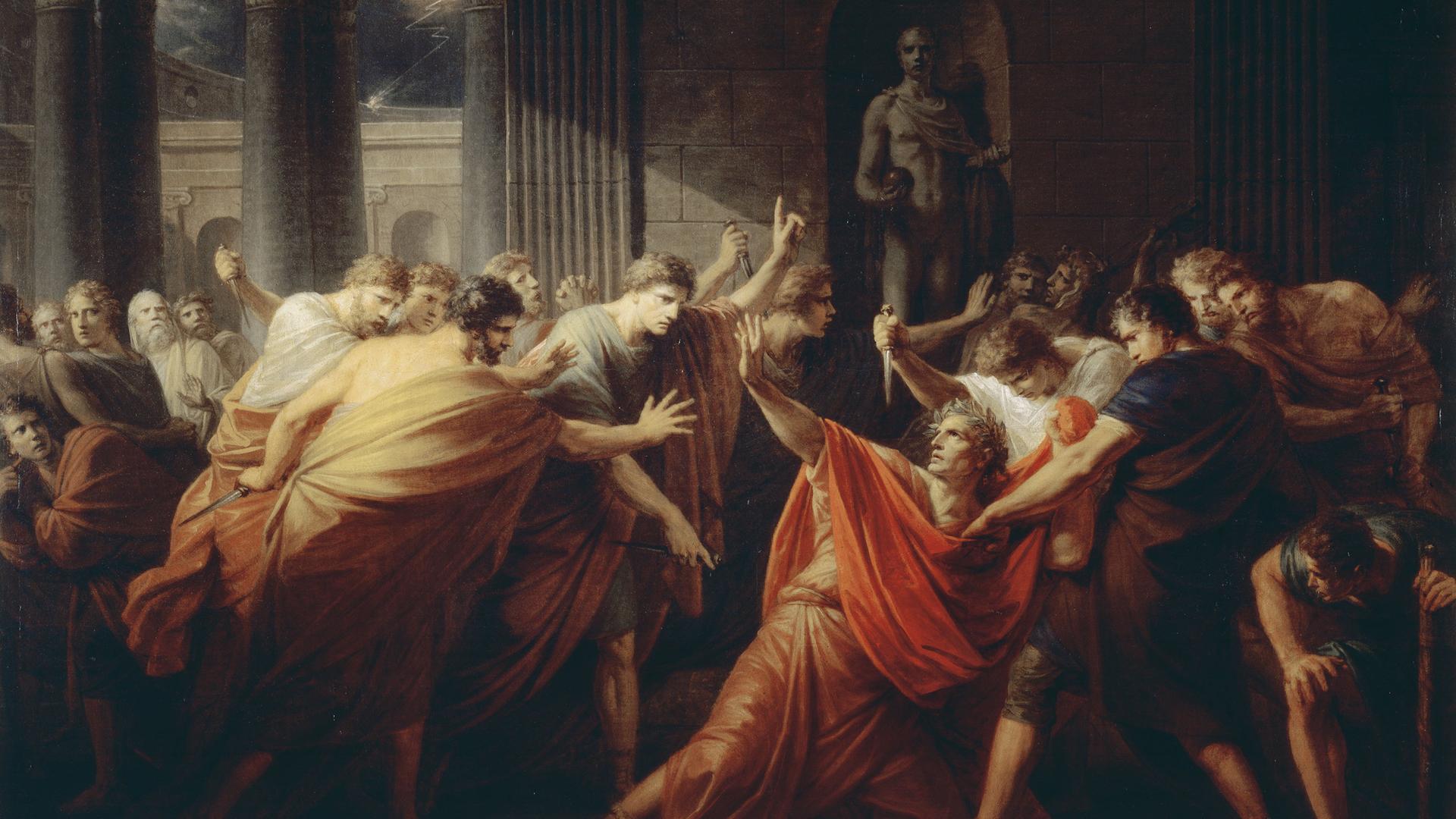 Auf dem Gemälde von Friedrich Heinrich Füger wird Julius Cäsar von umstehenden Männern erstochen.