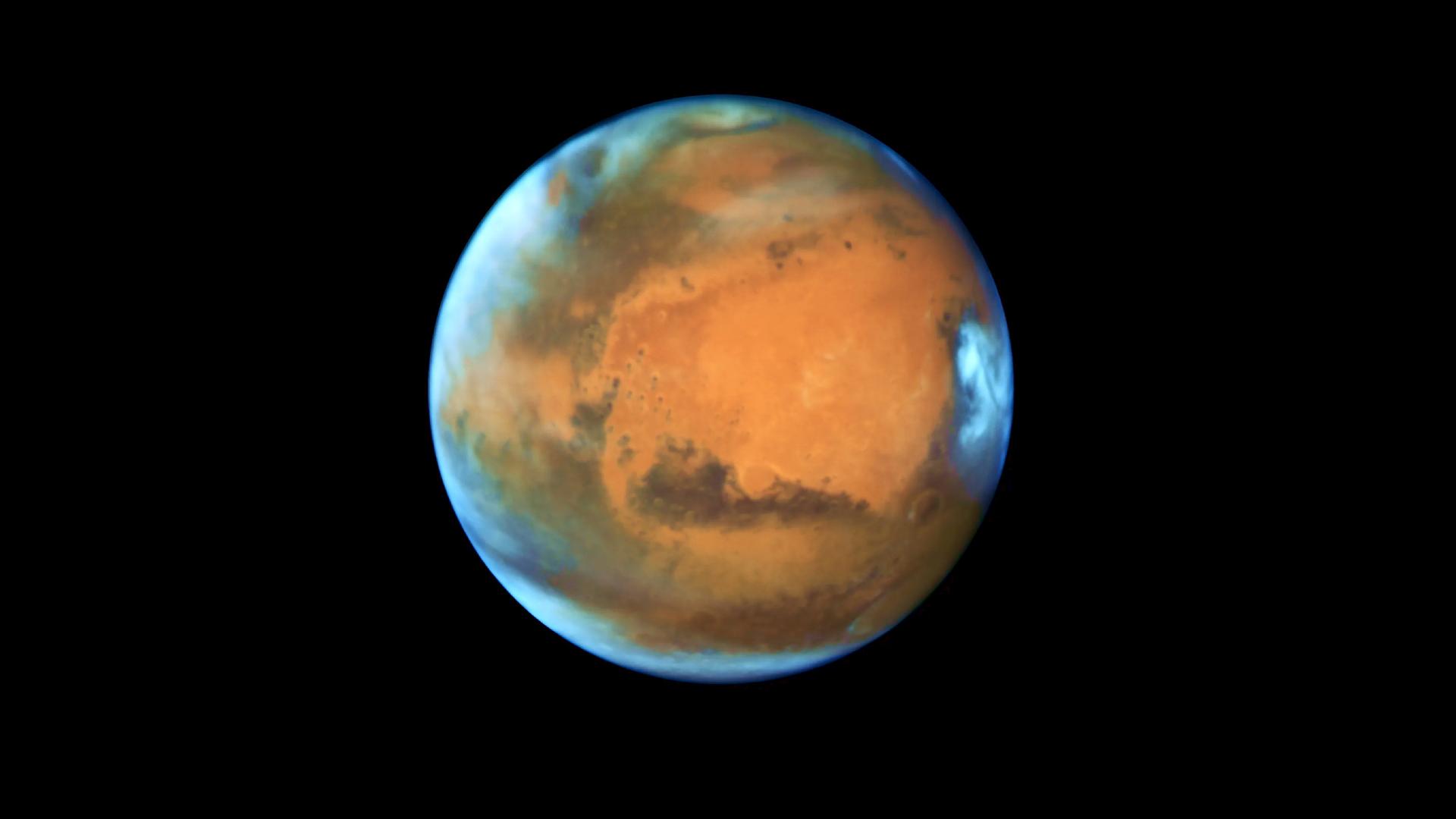 Der Planet Mars in Großaufnahme im dunklen Weltalll Der Planet Mars in Großaufnahme im dunklen Weltalll