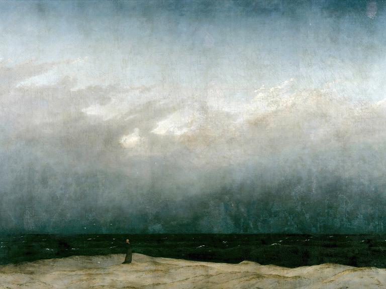 Das Gemälde "Der Mönch am Meer" von Caspar David Friedrich, eine kleine Mönchssilhouette steht vor einer Meereslandschaft.