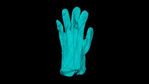 Ein Paar türkise Gumminhandschuhe auf schwarzem Grund Ein Paar türkise Gumminhandschuhe auf schwarzem Grund