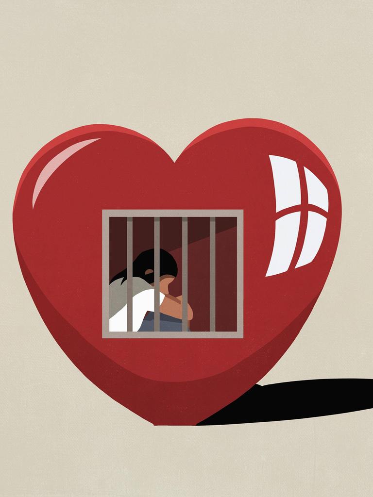 Eine Frau sitzt mit hängendem Kopf im Inneren eines Herzens: Sie ist durch ein vergittertes Fenster zu sehen. (Illustration)