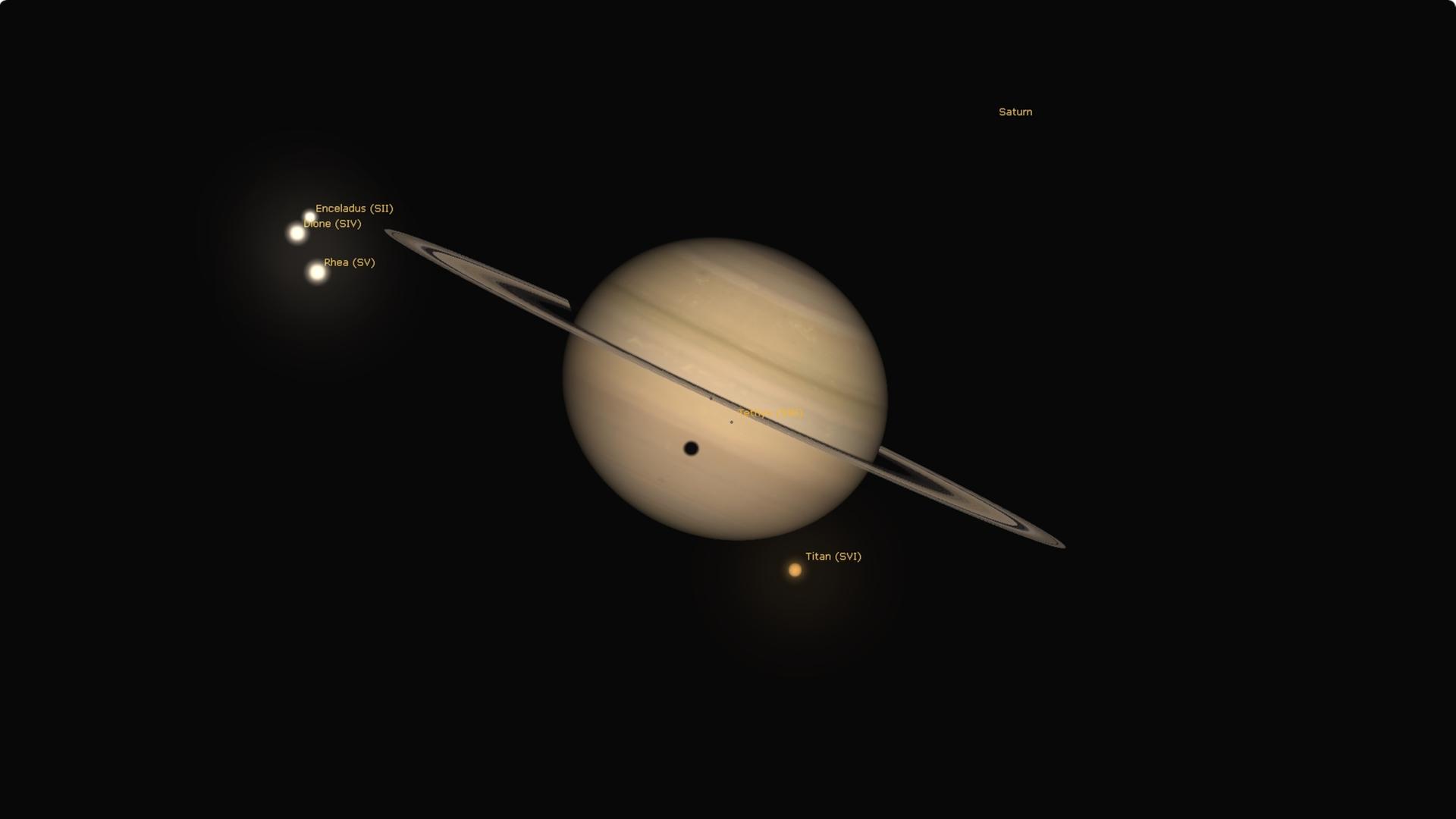 Der Schatten des Mondes Titan (rechts unterhalb) fällt für einige Stunden auf den Gasriesen Saturn.