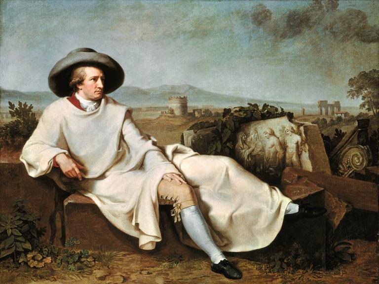 Ein Gemälde zeigt Goethe vor einer italienischen Landschaft auf einer Chaiselongue