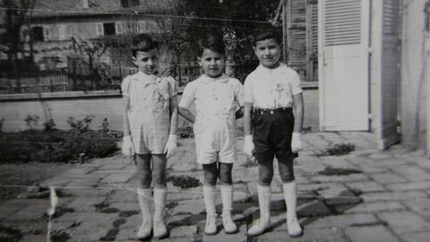 Guy Brun, Gérald und Robert Finaly bei der Taufe von Robert und Gérald