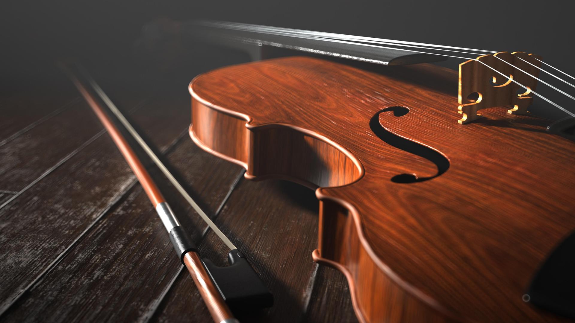Ein Violoncello liegt auf einem Holzboden