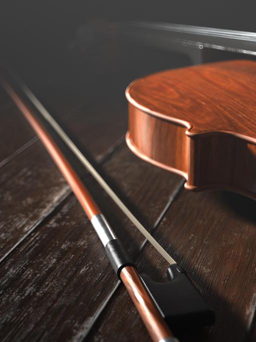 Ein Violoncello liegt auf einem Holzboden