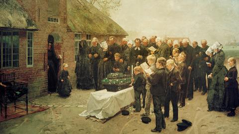 Auf dem Gemälde "Nordfriesisches Begräbnis" des Künstlers Ch. L.Brokelmann von 1887 steht eine Dorfgemeinschaft vor einem typischen Friesenhaus unter Reet um einen Sarg herum und singt, mittendrin der Pastor. 
