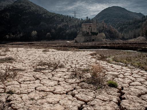 March 20, 2023, Cercs, Barcelona, Spain: The ancient Romanesque monastery of Sant Salvador de la Vedella, which normally is surrounded by water, is seen at the dry riverbed of the Llobregat river while entering the reservoir of La Baells in Cercs, Barcelona Province, Spain. Water restrictions tightened further in Catalonia due to ongoing drought that has now been for 29 months and that is related to climate change and global warming. Currently, Catalan reservoirs are at 27 percent of their capacity. (Credit Image: ÃÂ© Jordi Boixareu/ZUMA Press Wire
