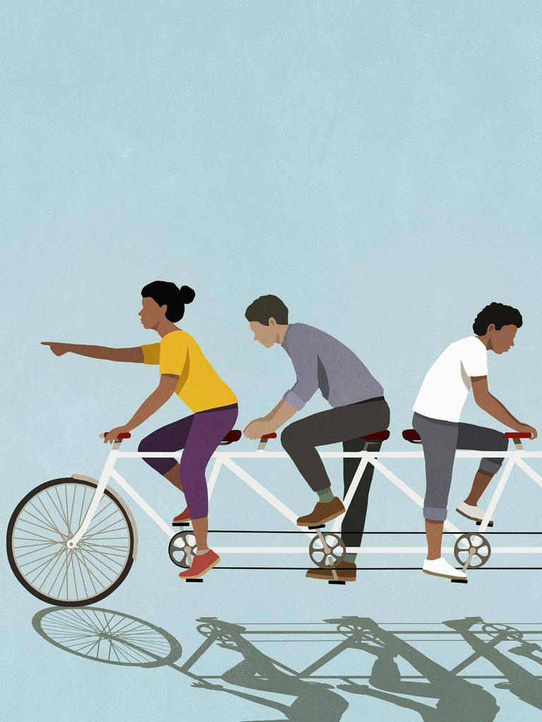 Illustration von vier Menschen auf einem viersitzigen Fahrrad, wobei zwei nach rechts und zwei nach links treten (Symbolbild)