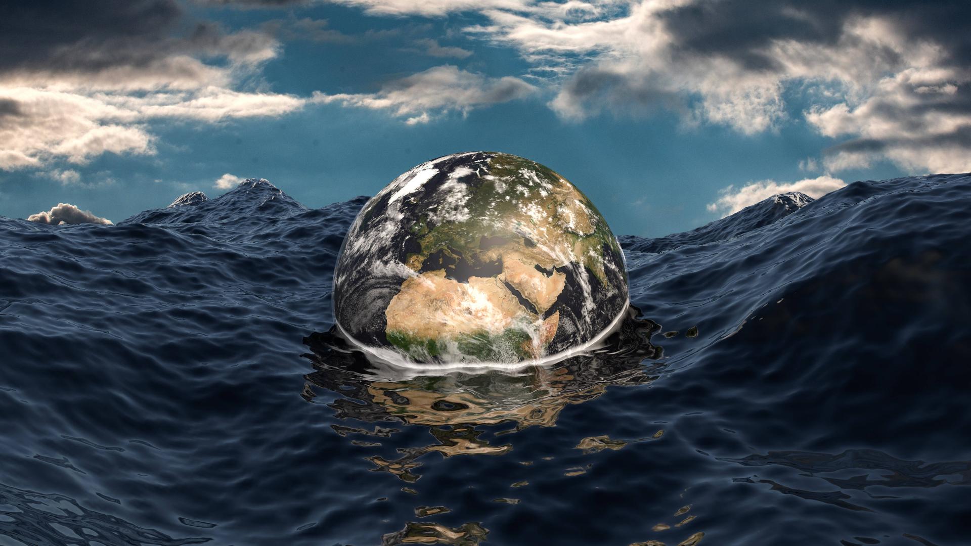 Eine Weltkugel droht in einem aufgepeitschten Ozean unterzugehen.