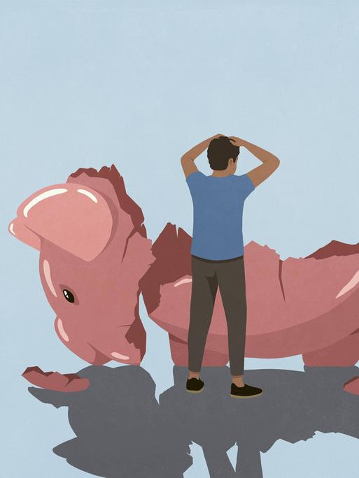 Ein gestresster Mann schaut auf ein übergroßes leeres zerschlagenes Sparschwein.