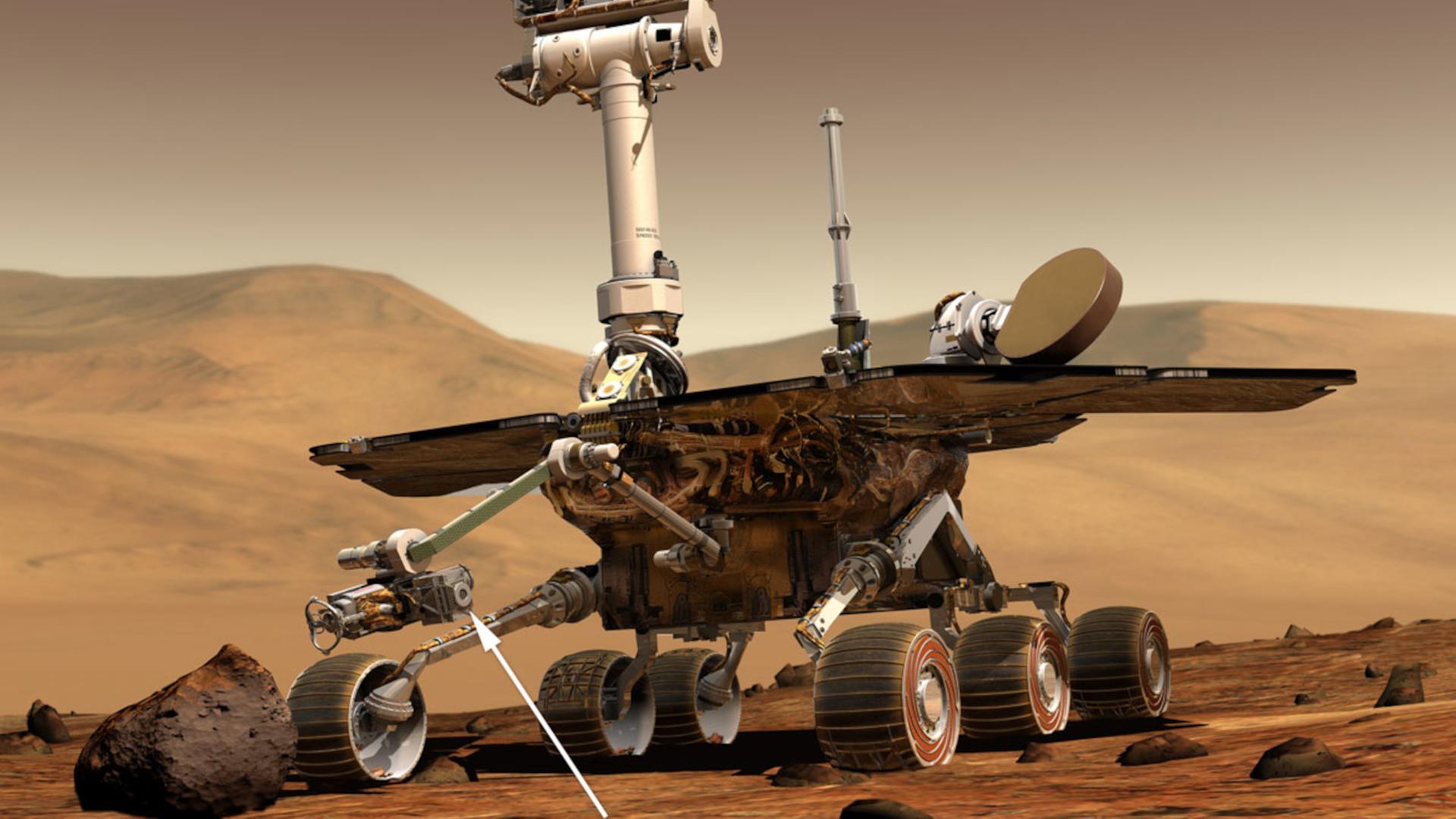 Illustration des NASA-Rover Spirit und Opportunity mit Mößbauer-Spektrometern (Pfeil). 