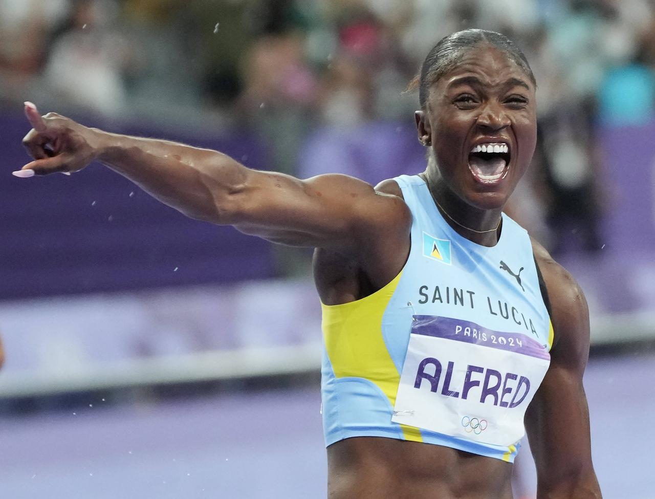 Julien Alfred of Saint Lucia celebrates after winning the gold medal in the Women s 100m Final during the Athletics competition at the Paris 2024 Olympic Games