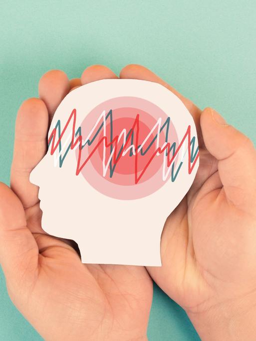 Illsutration: Auf einen Gehrin sind die Kurven eines Gehirnscans zu sehen. Über das Gehirn werden schützend Hände gehalten. 