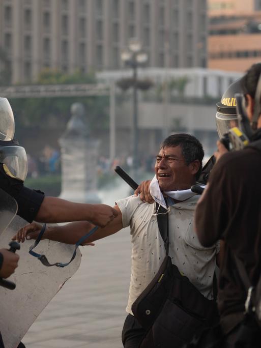 January 26, 2023, Lima, Peru: A man is surrounded and attacked by the Peruvian national police. The man screams in pain at the excessive force with which he is detained. Lima Peru - ZUMAqp1_ 20230126_zip_qp1_008 Copyright: xHectorxAdolfoxQuintanarxPerezx