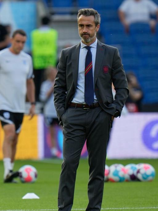 Spain's manager Jorge Vilda stands on the pitch during warm up prior to the Women Euro 2022 quarter final soccer match between England and Spain at the Falmer stadium in Brighton, Wednesday, July 20, 2022. (AP Photo/Alessandra Tarantino)