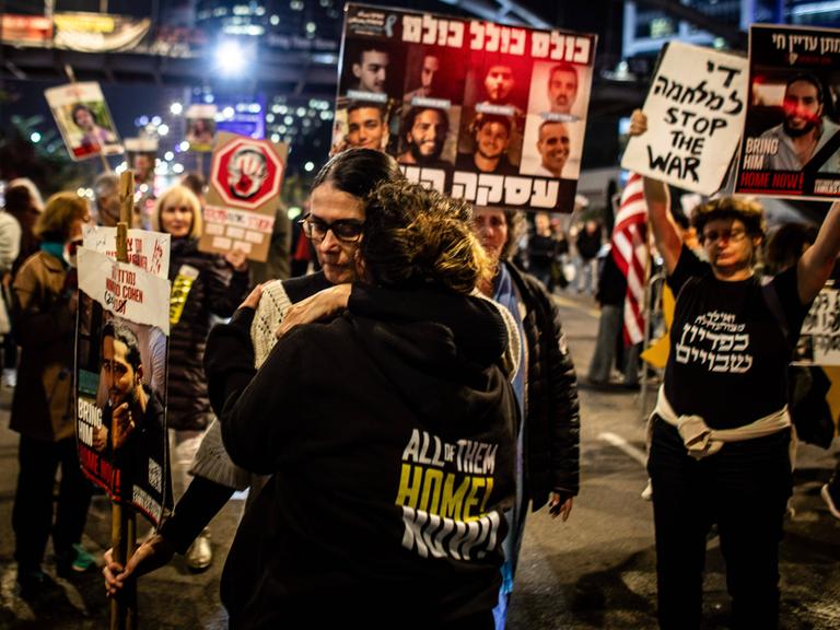 January 15, 2025, Tel Aviv, Israel: A woman holds a placard of Israeli Hostage Nimrod Cohen as she hugs a youth during a protest in Tel Aviv calling for the release of all 98 hostages.