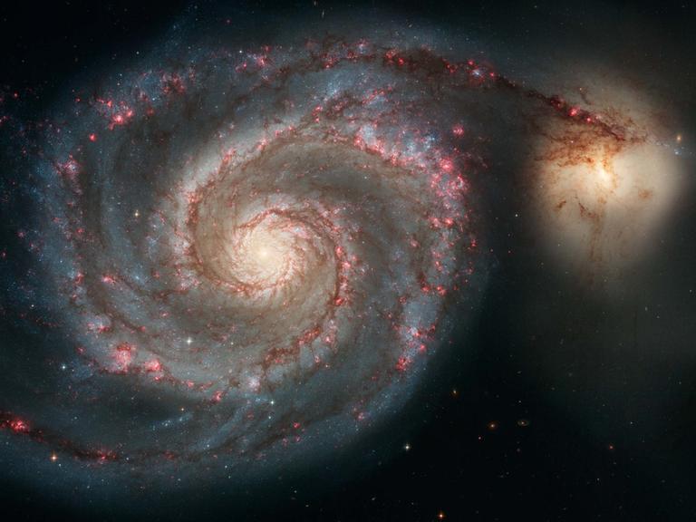 Wie schnell sich die Galaxien (hier M51) im Kosmos entfernen, ist ein großes Rätsel.