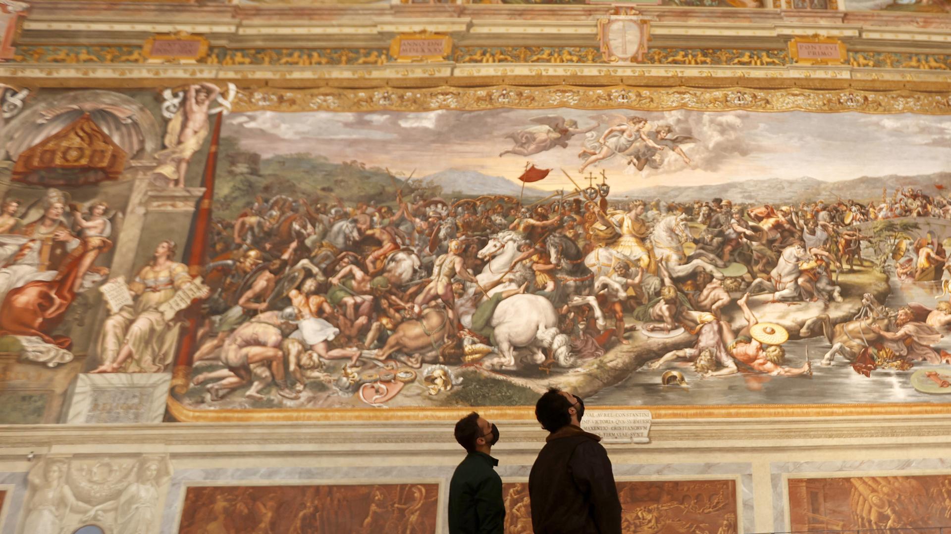 VATICAN, VATICAN CITY, MAY 03: Tourists admire one of the Raphael Rooms, ahead of the re-opening of the Vatican Museums, at the Vatican City, on May 03, 2021. The re-opening follows the third closure of the Museums since the start of the COVID-19 pandemic, with more stringent rules, including obligatory bookings, punctuality in turning up, protective masks, and social distancing. Riccardo De Luca / Anadolu Agency