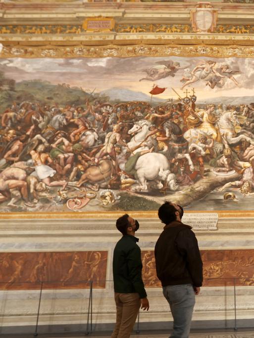 VATICAN, VATICAN CITY, MAY 03: Tourists admire one of the Raphael Rooms, ahead of the re-opening of the Vatican Museums, at the Vatican City, on May 03, 2021. The re-opening follows the third closure of the Museums since the start of the COVID-19 pandemic, with more stringent rules, including obligatory bookings, punctuality in turning up, protective masks, and social distancing. Riccardo De Luca / Anadolu Agency