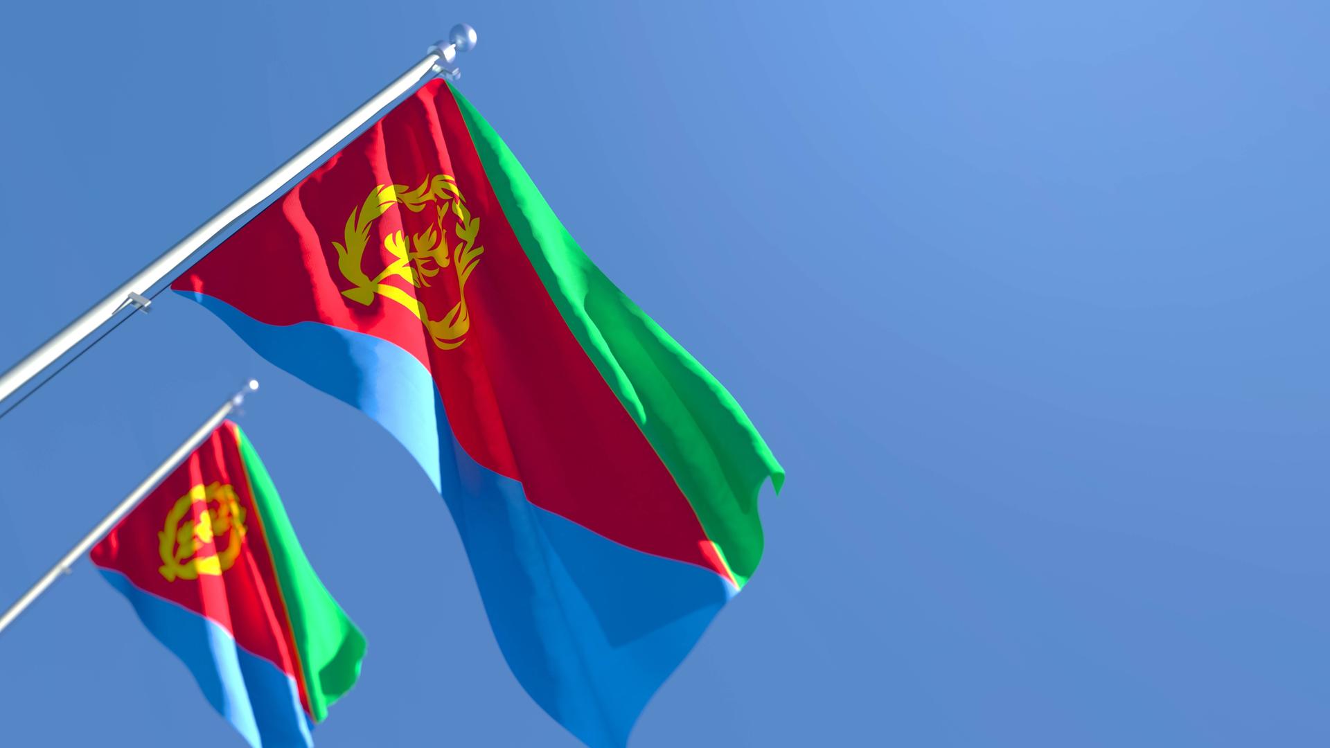 Zwei eritreische Flaggen wehen im Wind. Zwei eritreische Flaggen wehen im Wind.