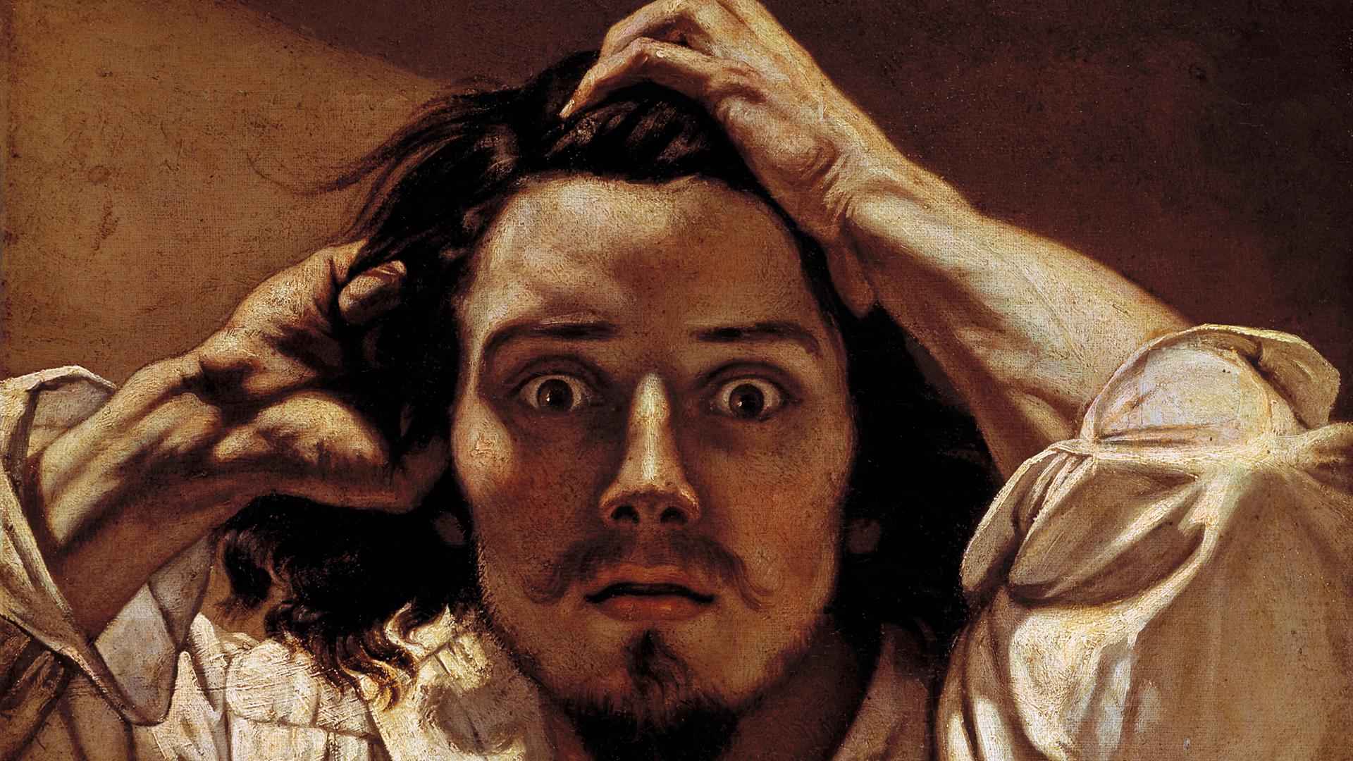 Auf dem Selbstbildnis "Der Verzweifelte" von Gustave Courbet blickt ein junger Mann auf den Betrachter herab und wühlt in seinem langen Haar. Auf dem Selbstbildnis "Der Verzweifelte" von Gustave Courbet blickt ein junger Mann auf den Betrachter herab und wühlt in seinem langen Haar.