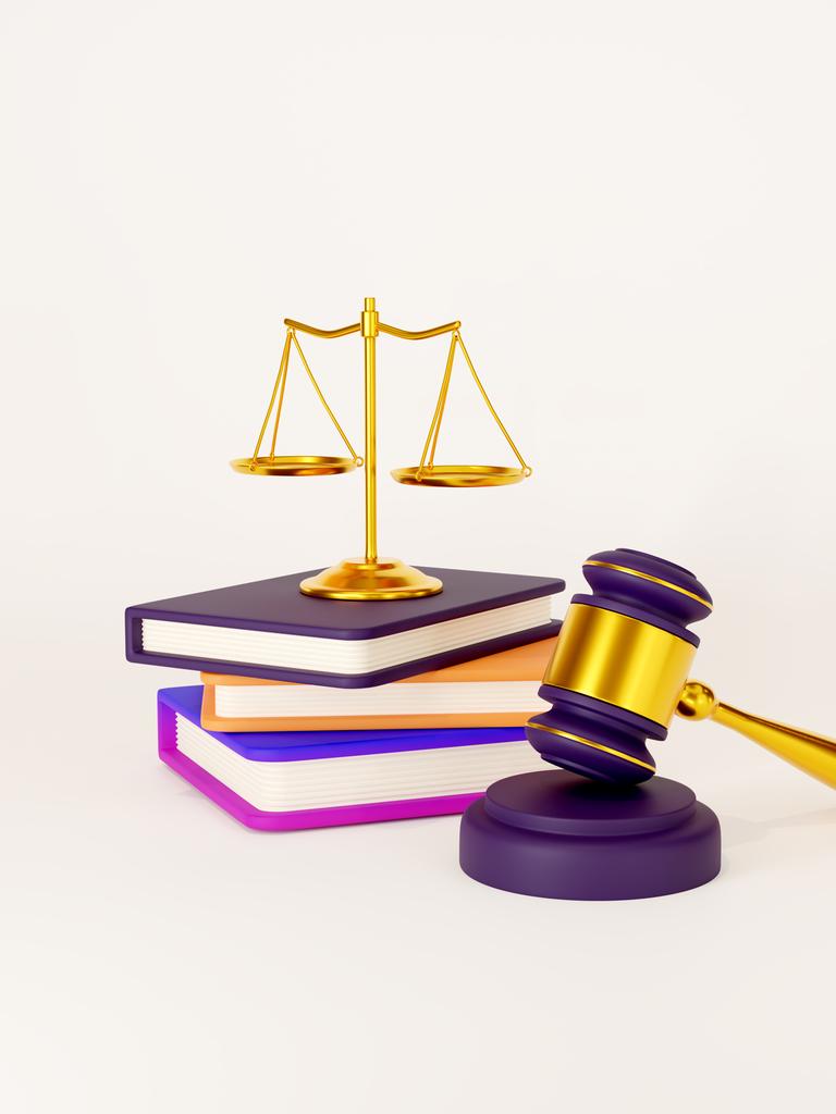 3D-Illustration eines Richterhammers, einiger Bücher und die Waage der Justitia. 