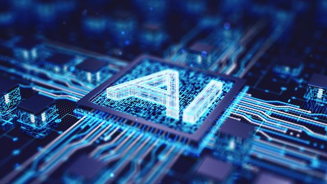 3D Rendering eines Mikrochip, auf dem die Buchstaben AI zu lesen sind. Der Chip liegt in der Mitte von einer Leiterplatte, auf der noch weitere Chips in blauen Tönen liegen.