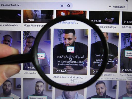 Offizieller TikTok-Kanal der Gruppierung "Muslim Interaktiv". Eine Lupe zeigt auf ein Video des Predigers Raheem Boateng. Offizieller TikTok-Kanal der Gruppierung "Muslim Interaktiv". Eine Lupe zeigt auf ein Video des Predigers Raheem Boateng.