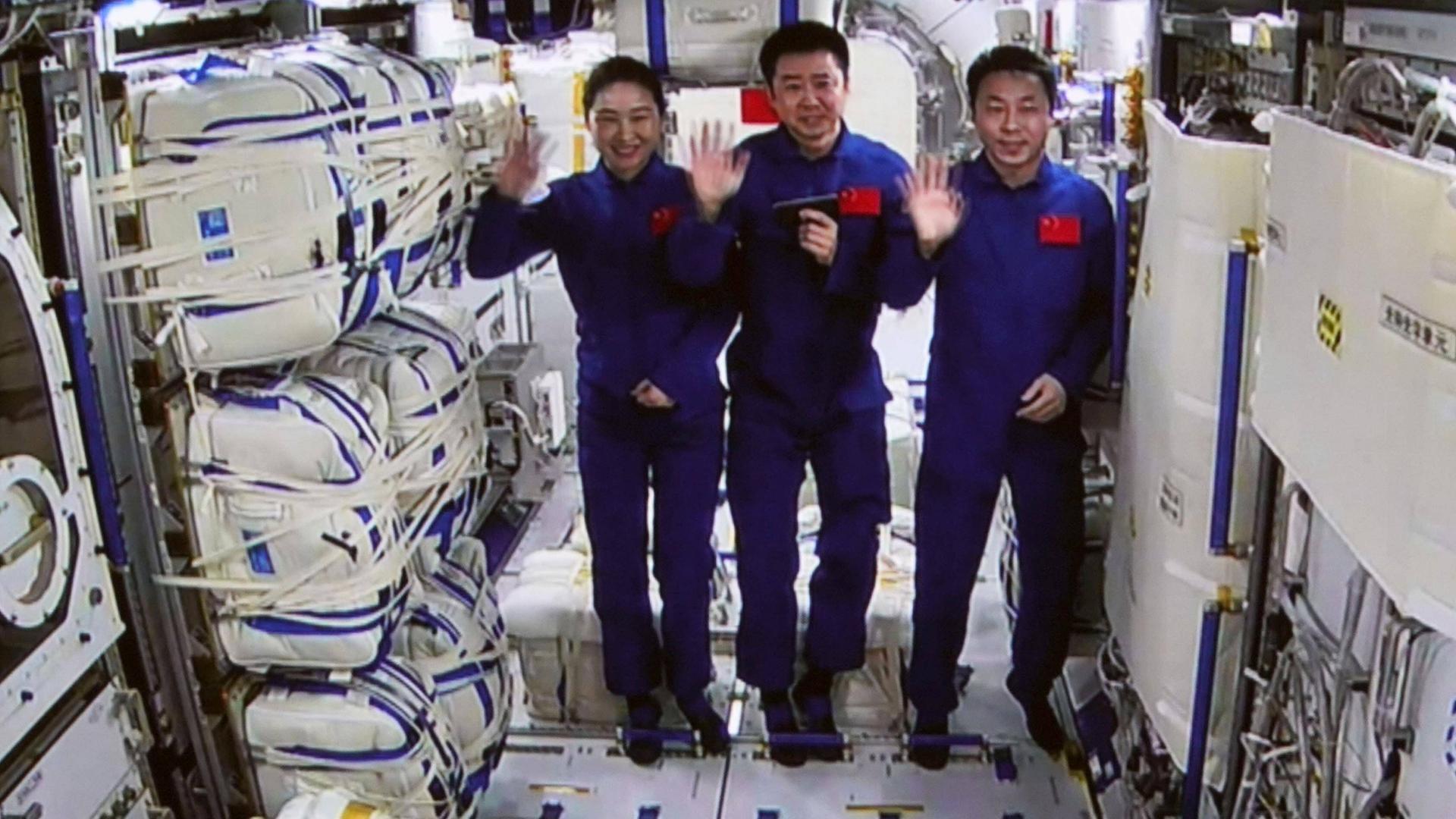  221103 -- BEIJING, Nov. 3, 2022 -- This screen image captured at Beijing Aerospace Control Center on Nov. 3, 2022 shows the Shenzhou-14 astronauts Chen Dong C, Liu Yang L and Cai Xuzhe waving inside the Mengtian lab module. The Shenzhou-14 astronauts successfully entered the Mengtian lab module of China s space station Tiangong at 3:12 p.m. Beijing Time on Thursday, according to the China Manned Space Agency. Following up, the Shenzhou-14 crew in the space station will welcome the subsequent arrival of the Tianzhou-5 cargo craft and Shenzhou-15 crewed spaceship, the agency said. The Shenzhou-14 and Shenzhou-15 crew members will then conduct the first in-orbit crew rotation in China s space history. China launched the space lab m PUBLICATIONxNOTxINxCHN