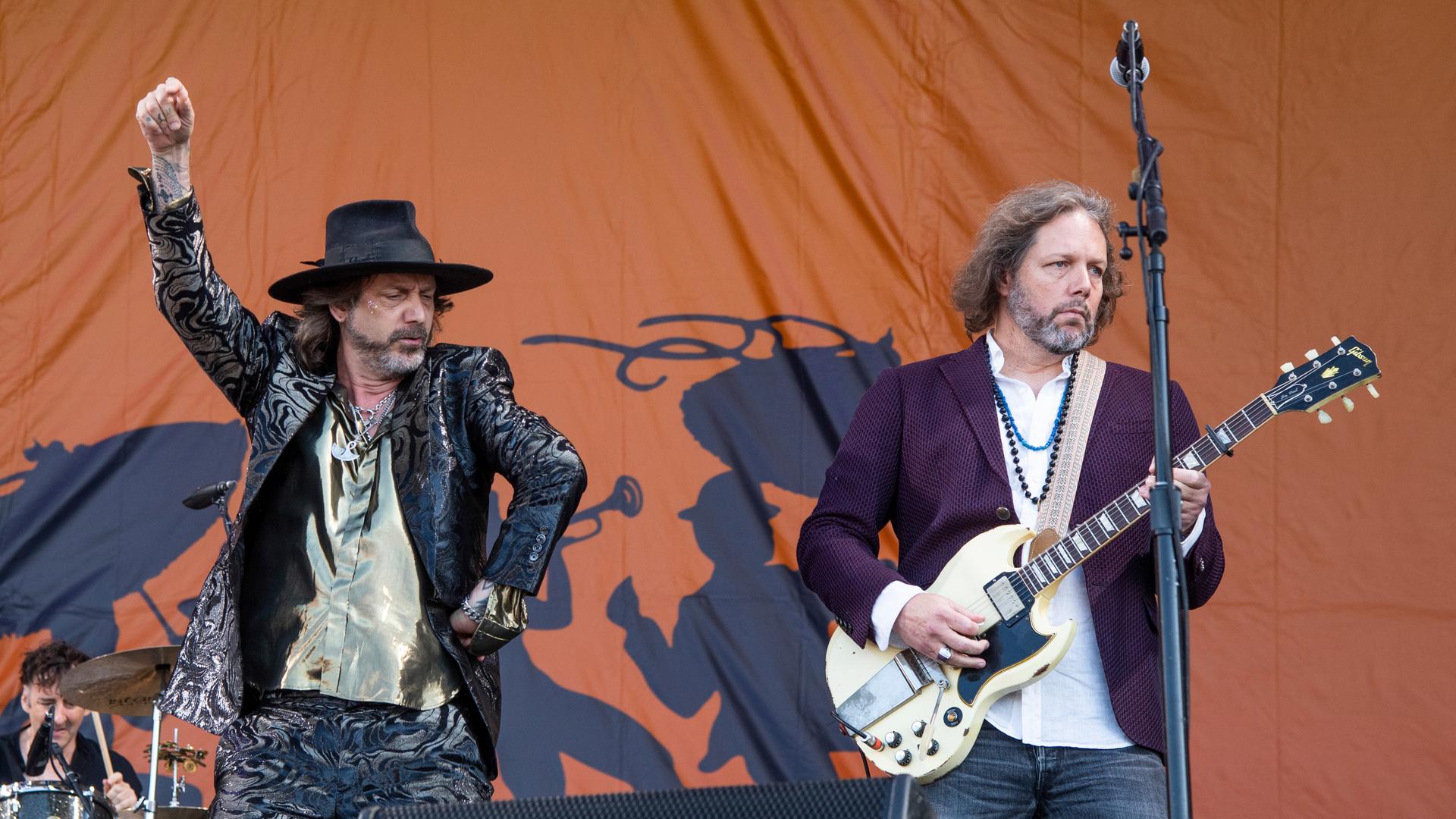 Chris Robinson, left, and Rich Robinson of The Black Crowes perform at the New Orleans Jazz and Heritage Festival, on Friday, May 6, 2022, in New Orleans. (Photo by Amy Harris/Invision/AP)