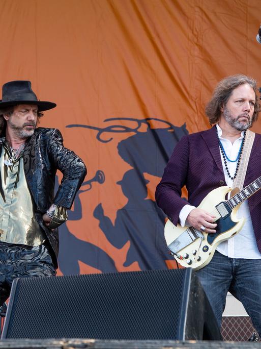 Chris Robinson, left, and Rich Robinson of The Black Crowes perform at the New Orleans Jazz and Heritage Festival, on Friday, May 6, 2022, in New Orleans. (Photo by Amy Harris/Invision/AP)