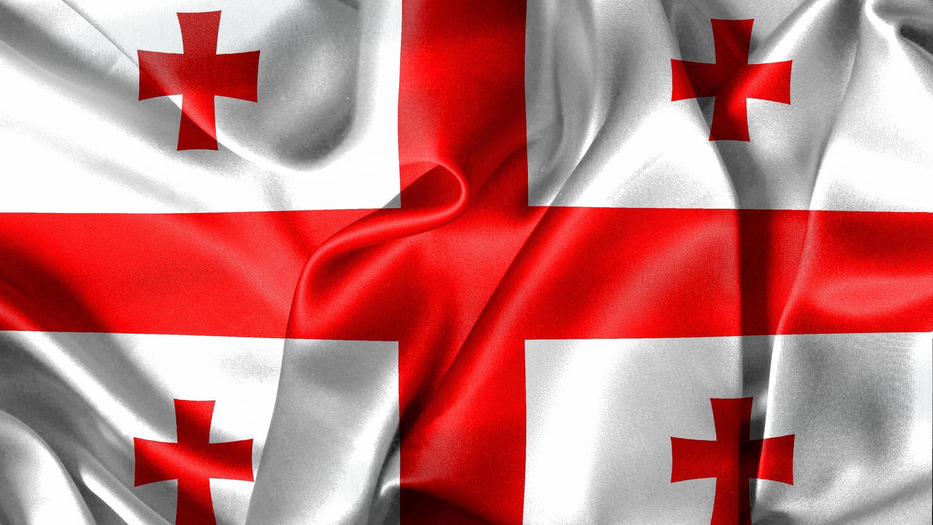Die georgische Nationalflagge: fünf rote Kreuze auf weißem Grund. Die georgische Nationalflagge: fünf rote Kreuze auf weißem Grund.