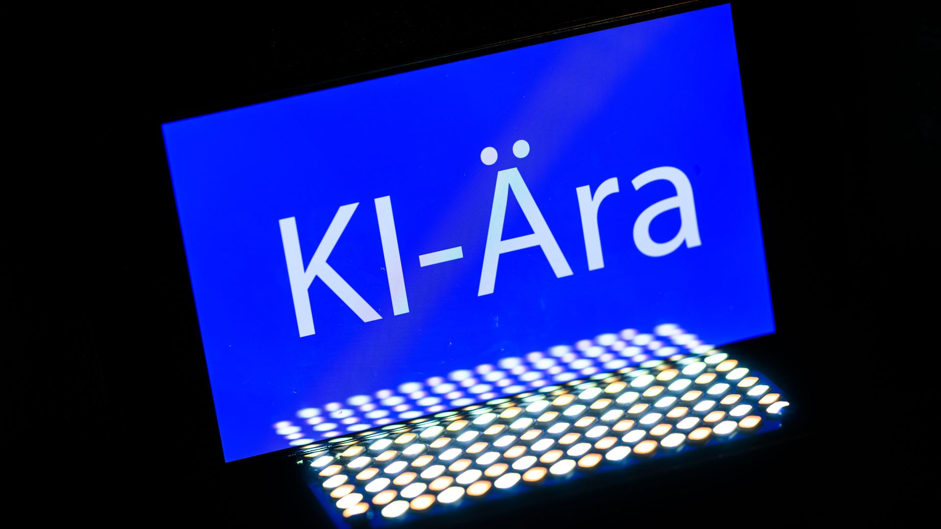 Das Wort "KI-Ära" ist auf einem Smartphone zu sehen.