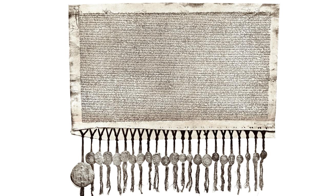 Der "Verbundbrief" von 1396 ist die mittelalterliche "Verfassung", mit der sich die in "Gaffeln" (Zünfte) organisierten Kölner Bürger von Kirche und Adel emanzipierten. Die Urkunde existierte in 23 Ausfertigungen - eine für die Stadt und jeweils eine für die 22 Gaffeln - symbolisiert durch die unten anhängenden Siegel.