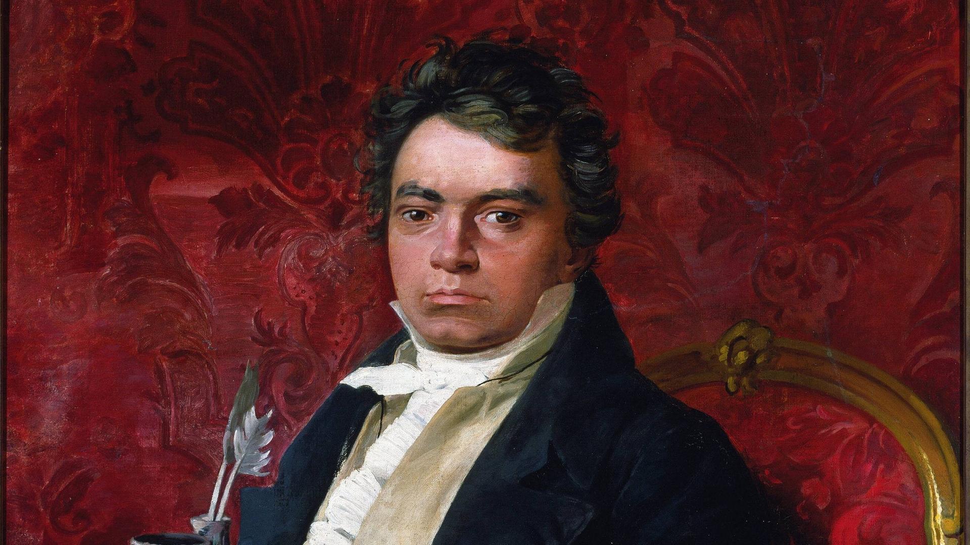 Gemälde eines anonymen Malers um 1900, der Beethoven vor einem Feuerrotem Hintergrund in einem goldenen Sessel zeigt, von Schreibutensilien umgeben.