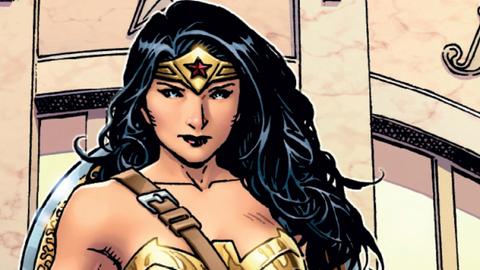 Die Superhelding Wonder Woman auf einer britischen Briefmarke. Sie hat schwarze lange Haare, ist sehr sexy und hält ein goldenes Lasso in der Hand.