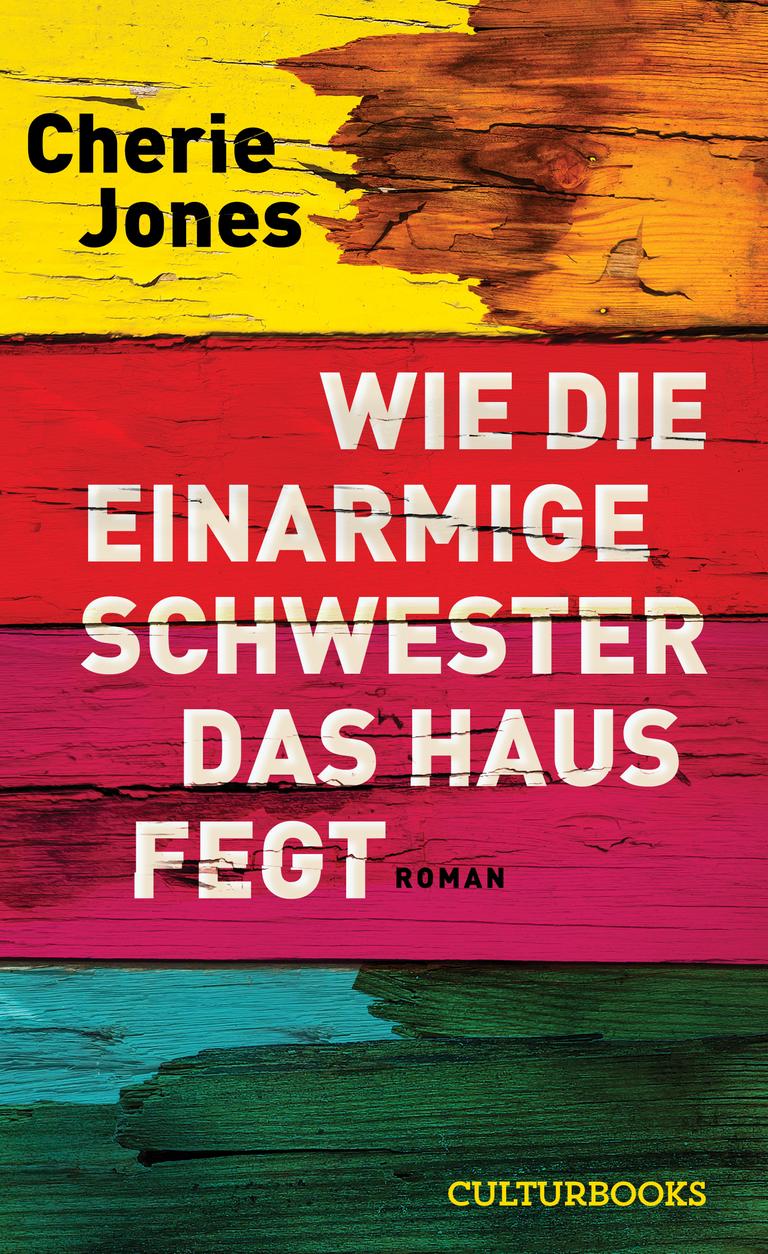Das Cover des Krimis von Cherie Jones, "Wie die einarmige Schwester das Haus fegt". Es zeigt den Namen der Autorin und den Titel auf einem mehrfarbigen Hintergrund, von oben nach unten Gelb, Rot und Türkis.