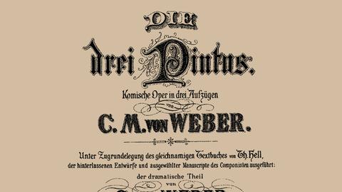 Das Deckblatt einer Partitur, in aufwändig gestalteten schwarzen Buchstaben steht dort: Die drei Pintos von Carl Maria von Weber., 1888. Copyright:xxFinexArtxImages/HeritagexImagesx / IMAGO ,2671605  ACHTUNG: AUFNAHMEDATUM GESCHÄTZT PUBLICATIONxNOTxINxUK Copyright:xFinexArtxImages/HeritagexImagesx / IMAGO
